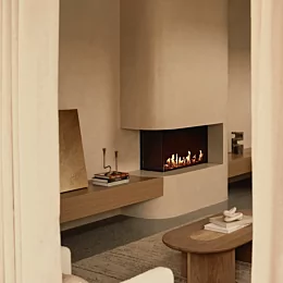 EcoSmart Fire Flex 32LC Fireplace installed in Layà Villas Villa A delivers clean-burning ethanol warmth in a modern indoor setting.